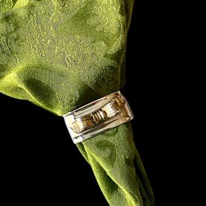 Set of 4 sterling and brass bow napkin rings